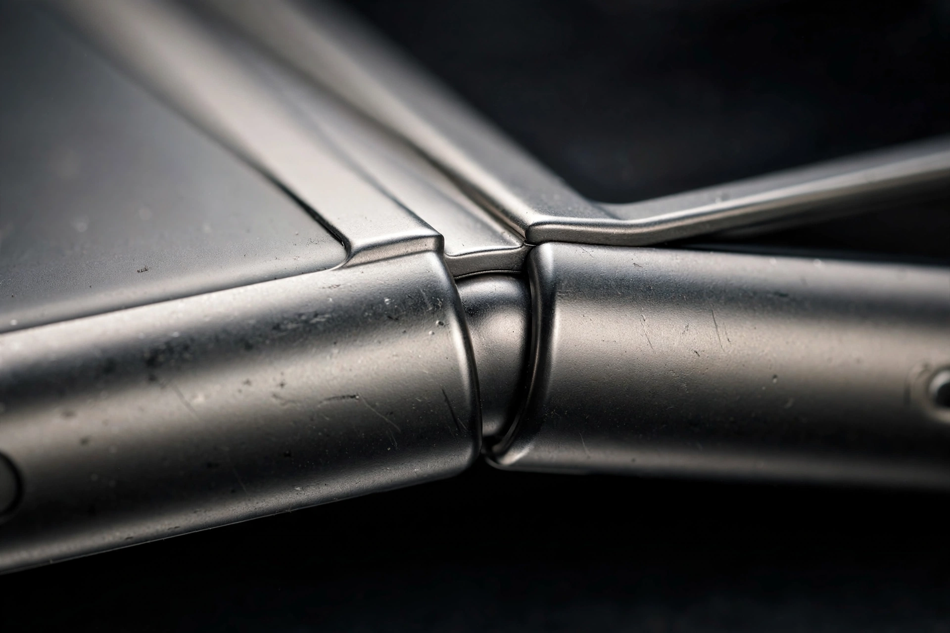 Close-up of the iPhone Duo precision hinge and Grade 5 titanium frame where the two halves meet