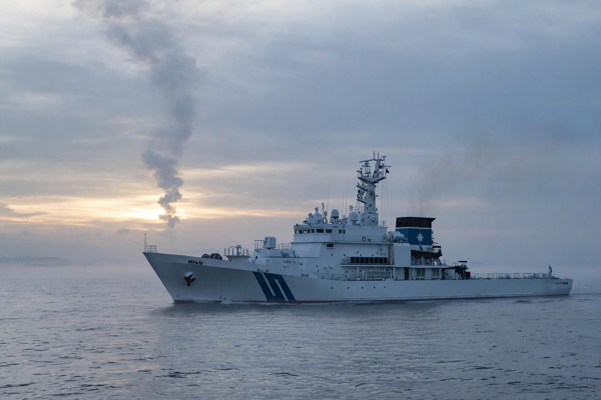 A coast guard patrol vessel on the East Sea at sunrise with a distant smoke trail in the sky